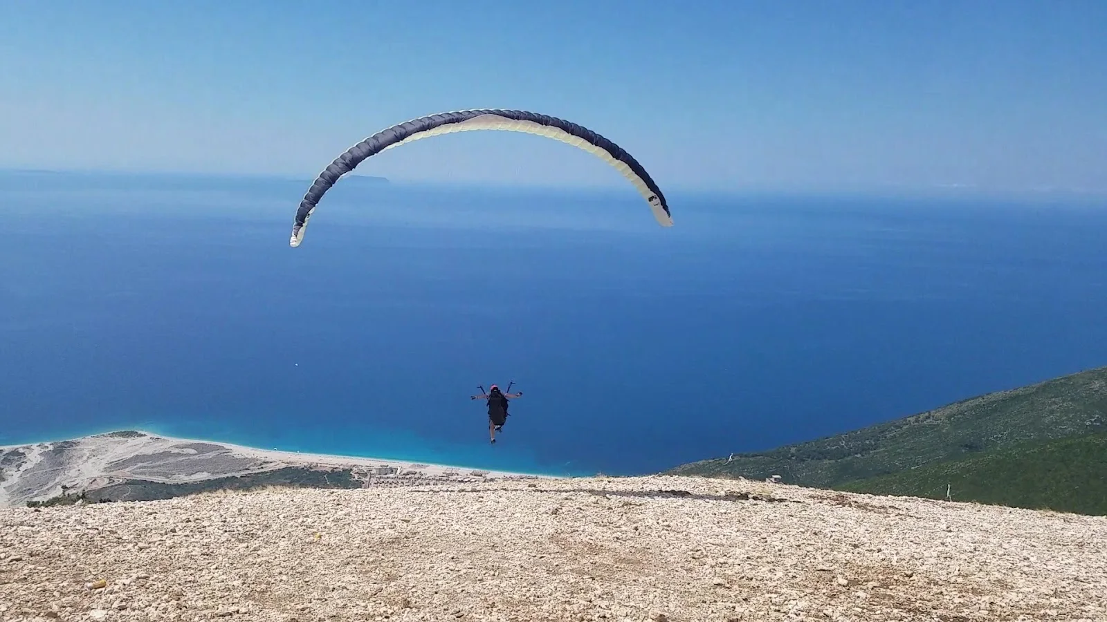 The mountain-and-sea panorama over the Albanian Riviera from Llogara Pass