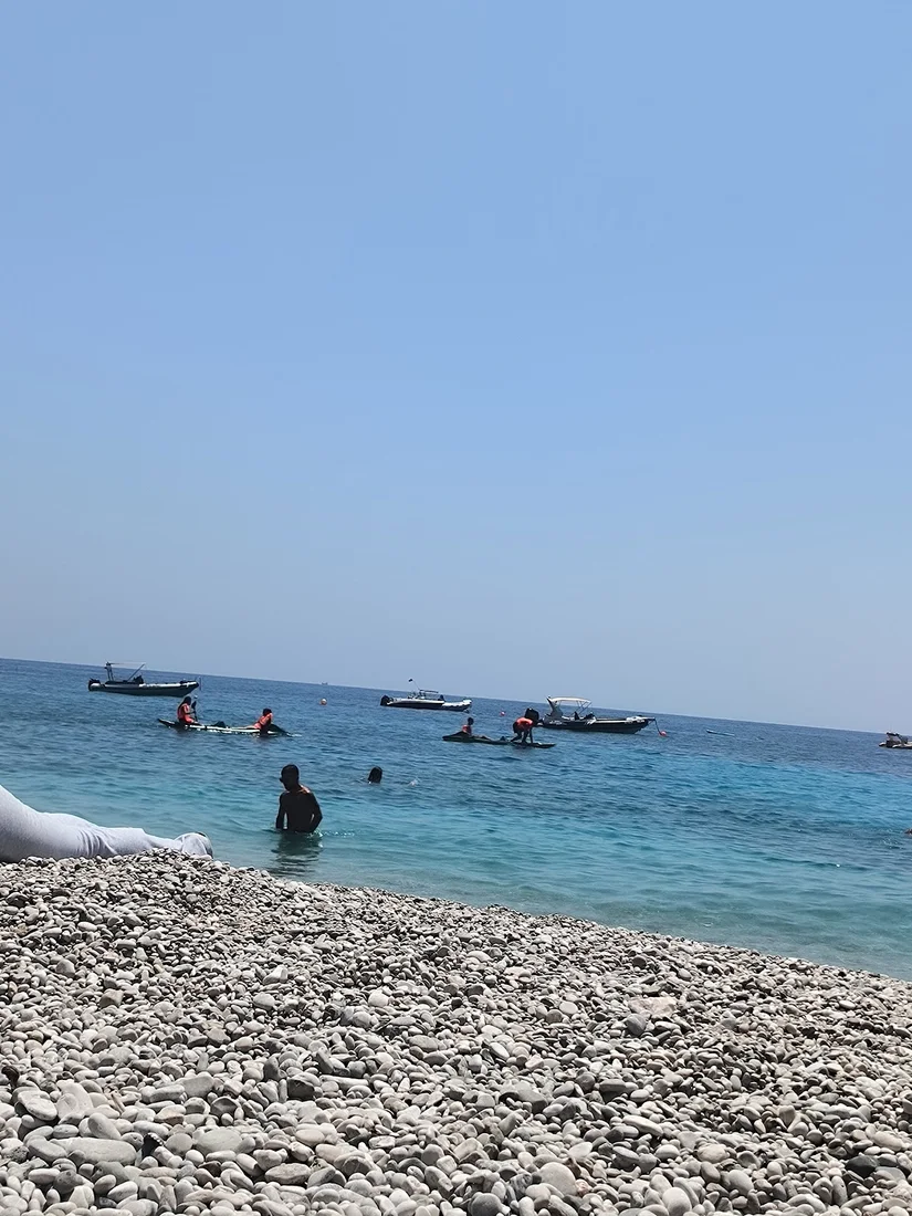 The white-pebble beach and turquoise water of Dhërmi on the Albanian Riviera