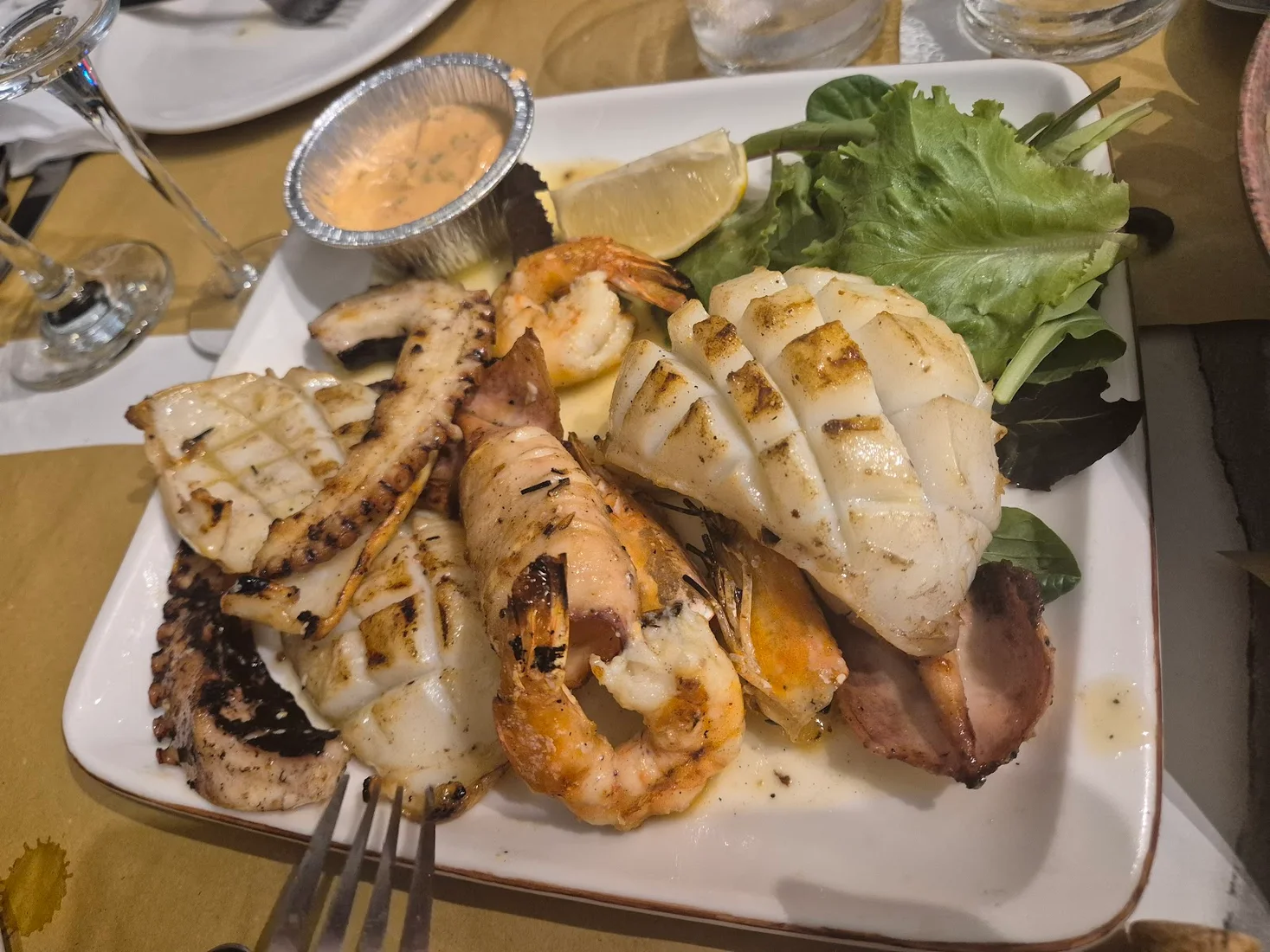 A mixed grilled seafood platter at Vela e Bardhë on Dhërmi Beach