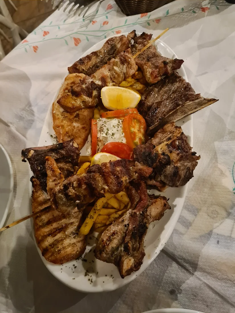A mixed grilled-meat platter with lamb chops and skewers at Drymades Village Restaurant, Dhërmi