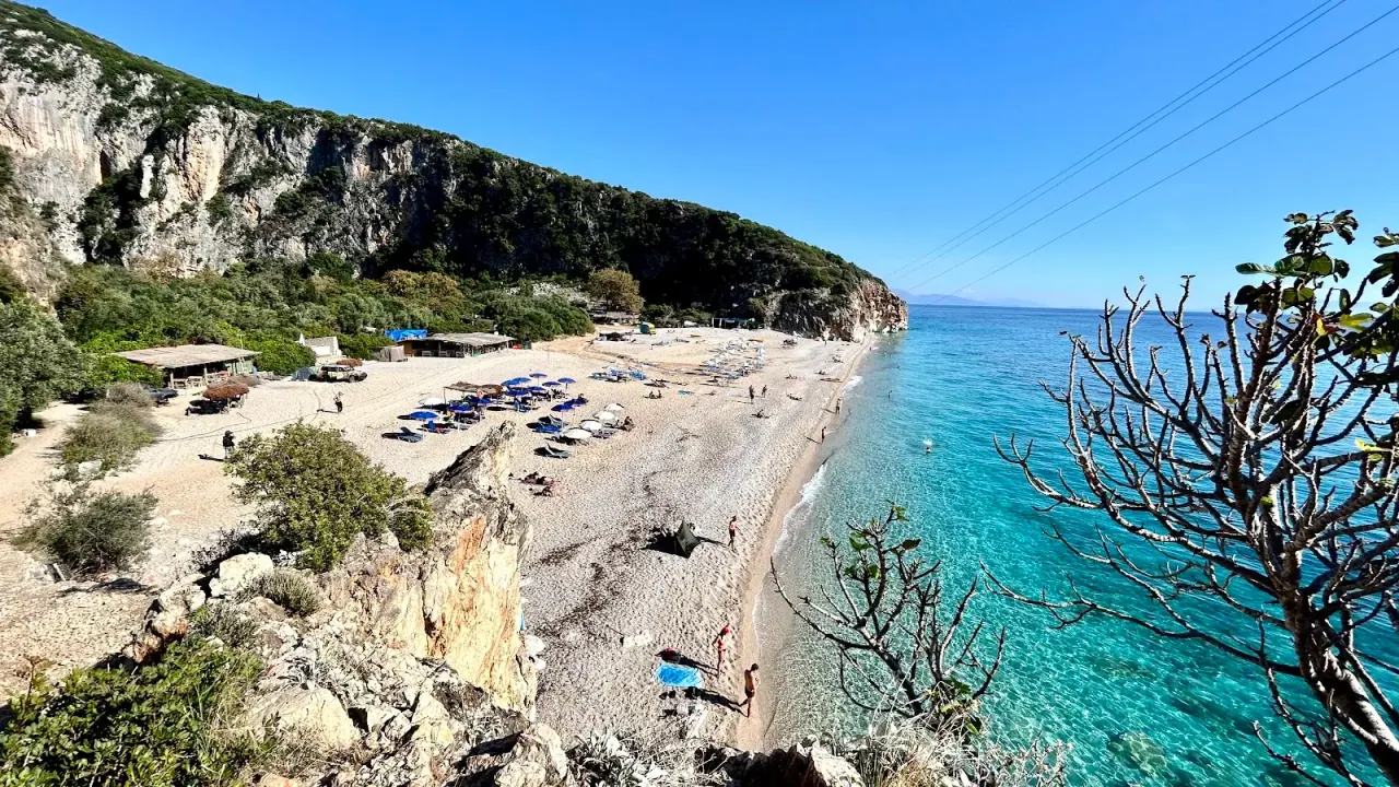 The turquoise water and pebble cove of Gjipe Beach reached by boat from Dhërmi