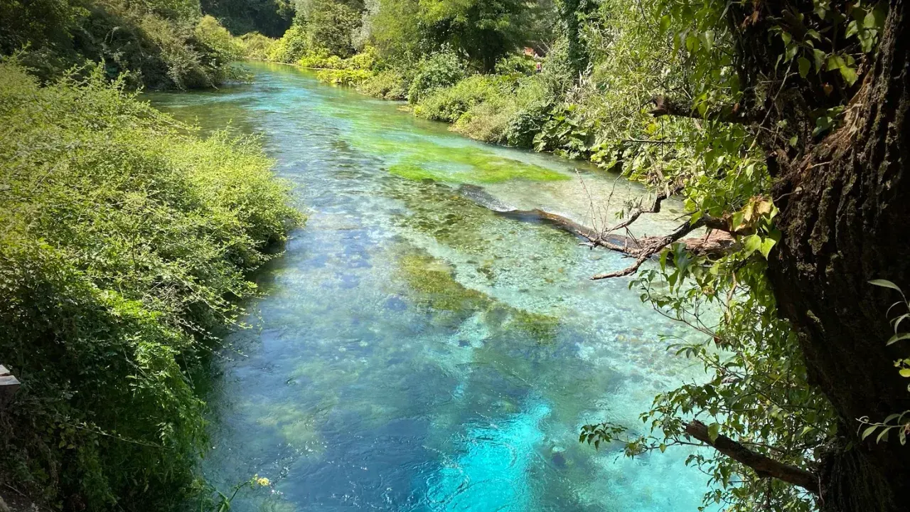 Vivid blue karst spring water in the forest near Sarandë in southern Albania