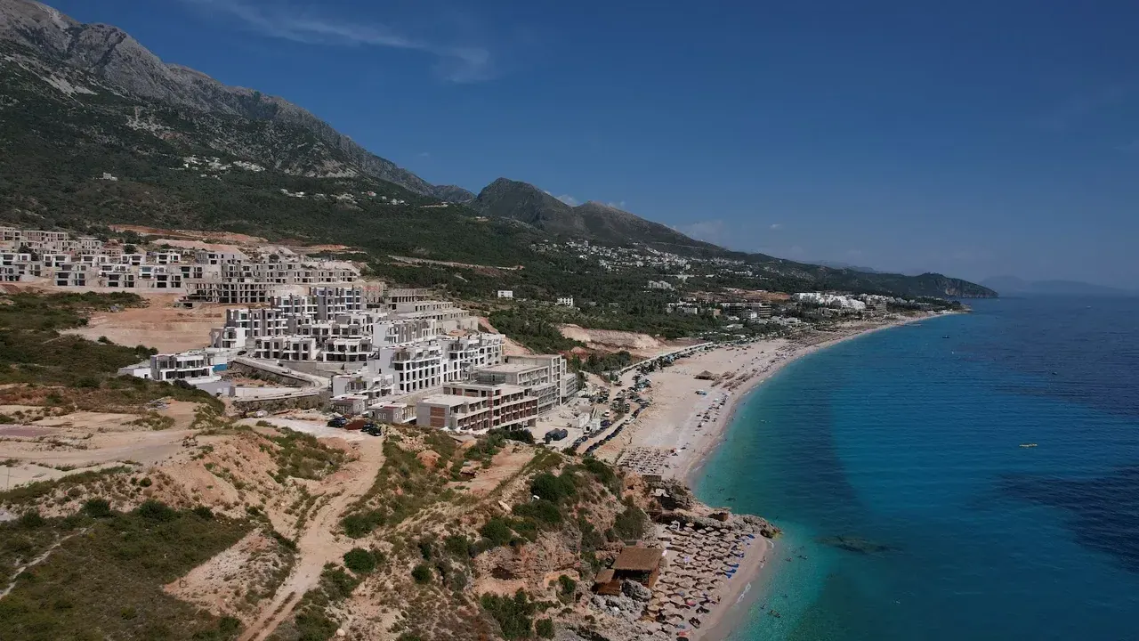 The Drymades coastline and turquoise water below the mountains near Dhërmi
