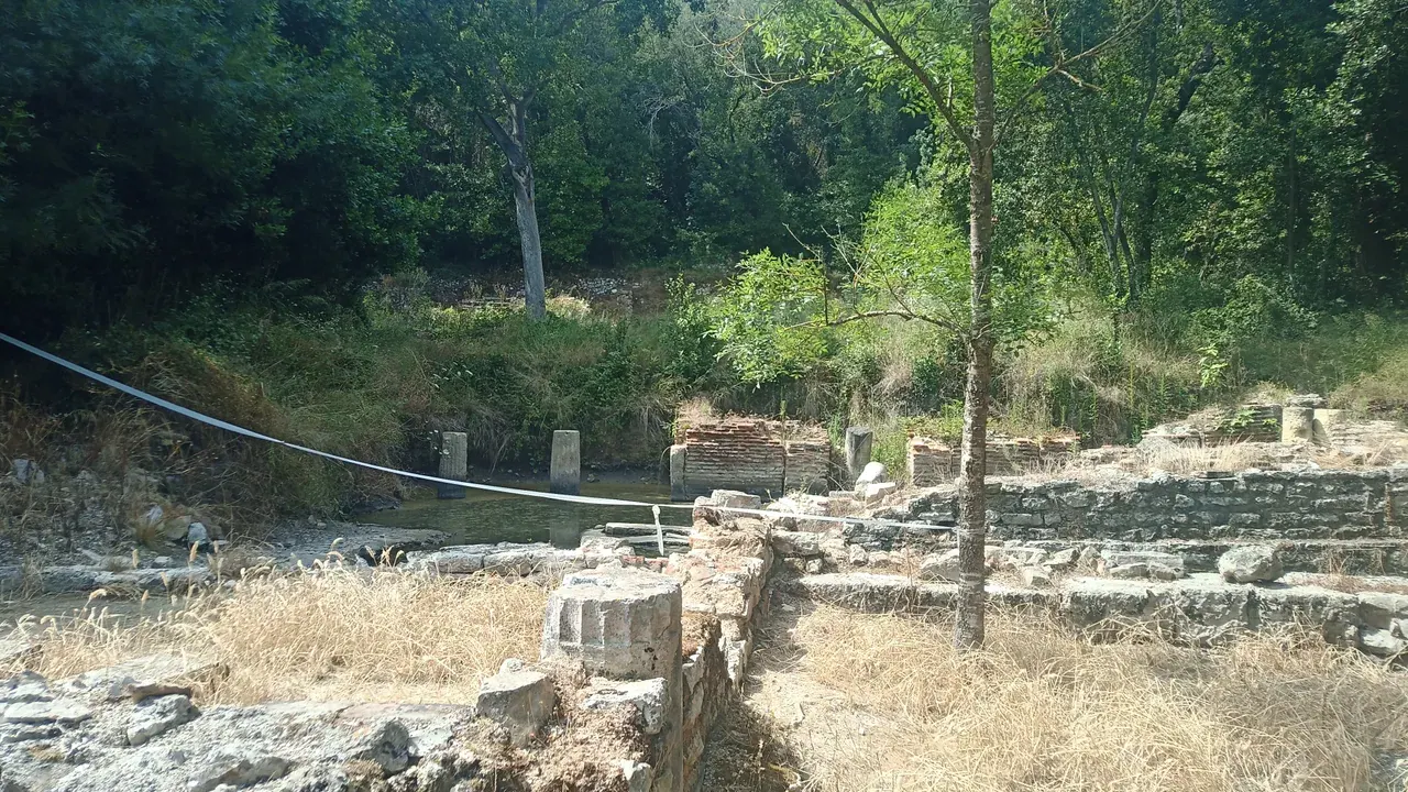 The wooded ruins of ancient Butrint beside its lagoon in southern Albania