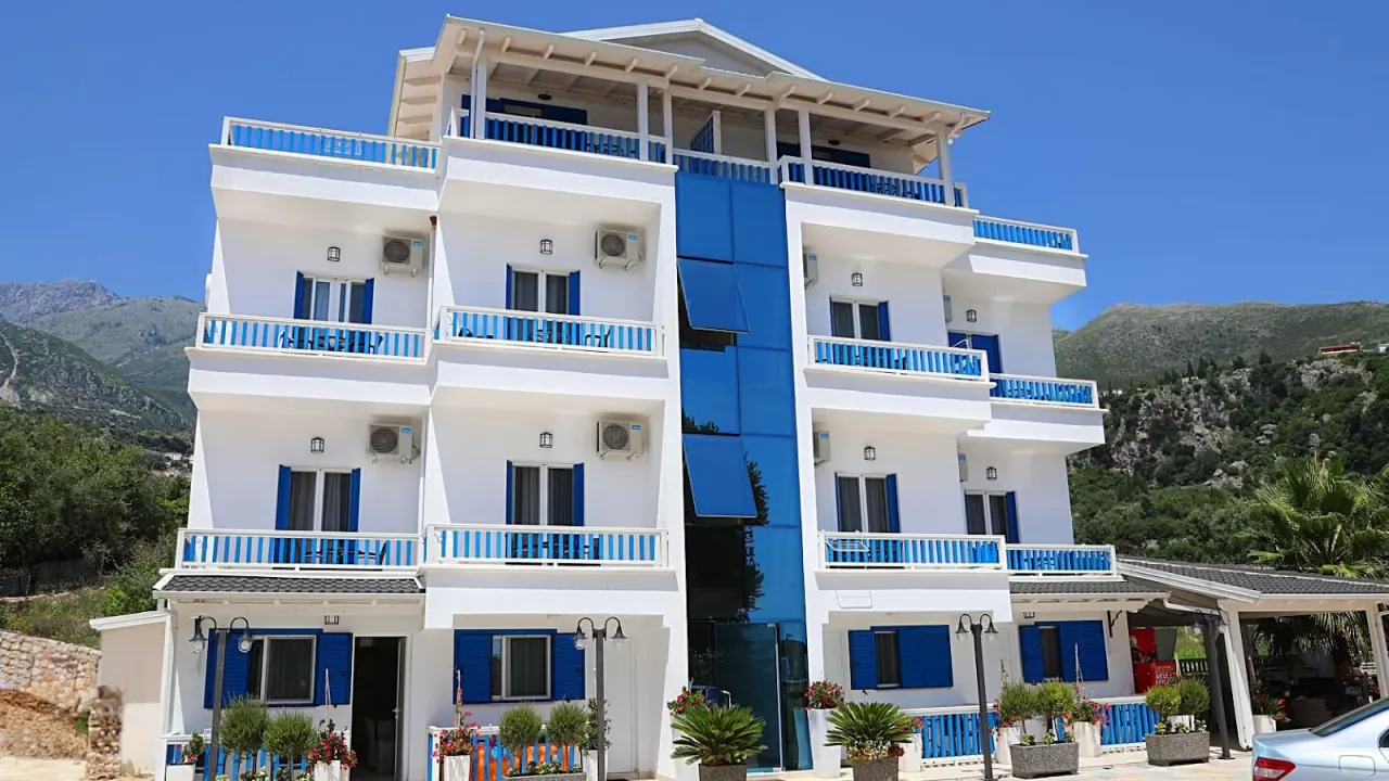 The blue-and-white facade of Hotel Sofo in Dhërmi