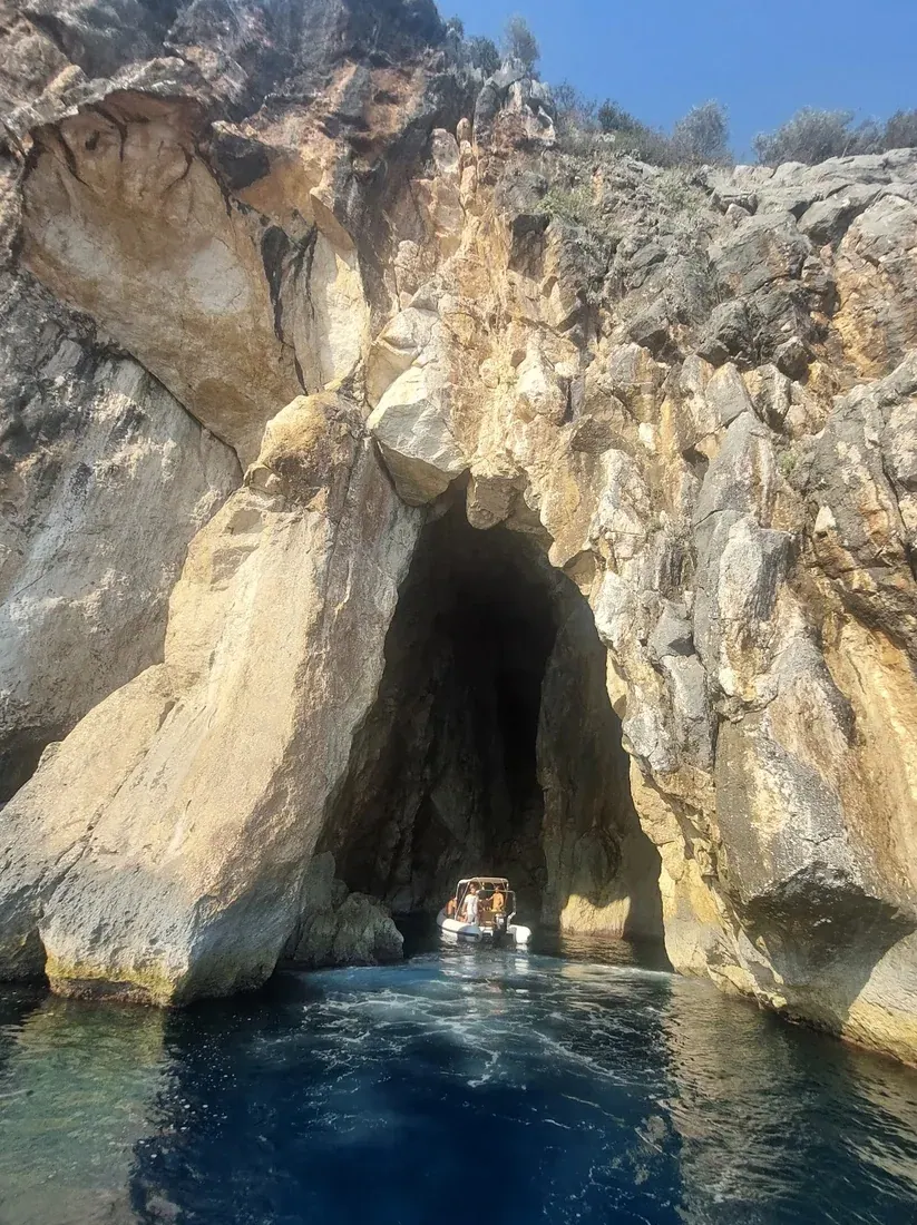 A boat entering the sea cave known as the Pirates' Cave near Dhërmi