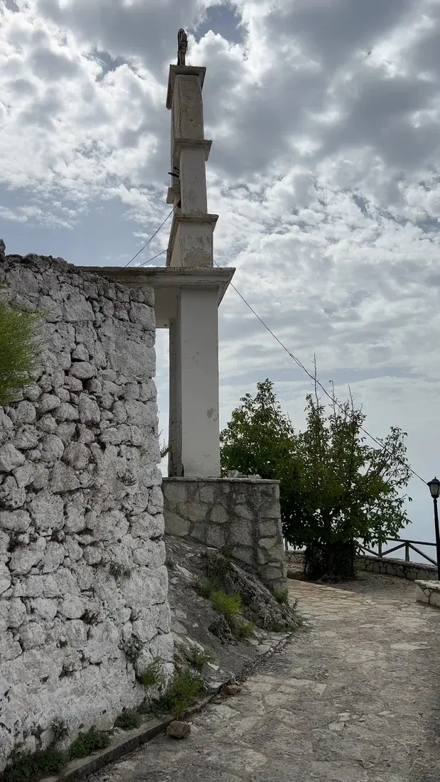The stone bell tower of St. Mary's Monastery above Dhërmi