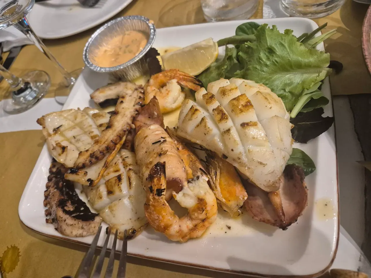 A mixed grilled seafood platter at Vela e Bardhë on Dhërmi Beach