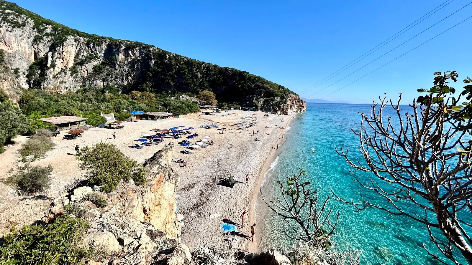 The turquoise water and pebble cove of Gjipe Beach reached by boat from Dhërmi